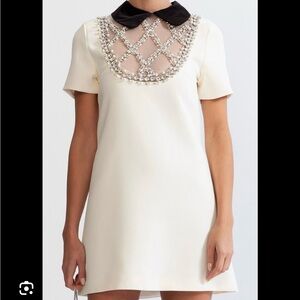 Elegant Cream Dress with Black Collar